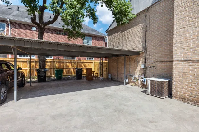 a view of a patio with table and chairs