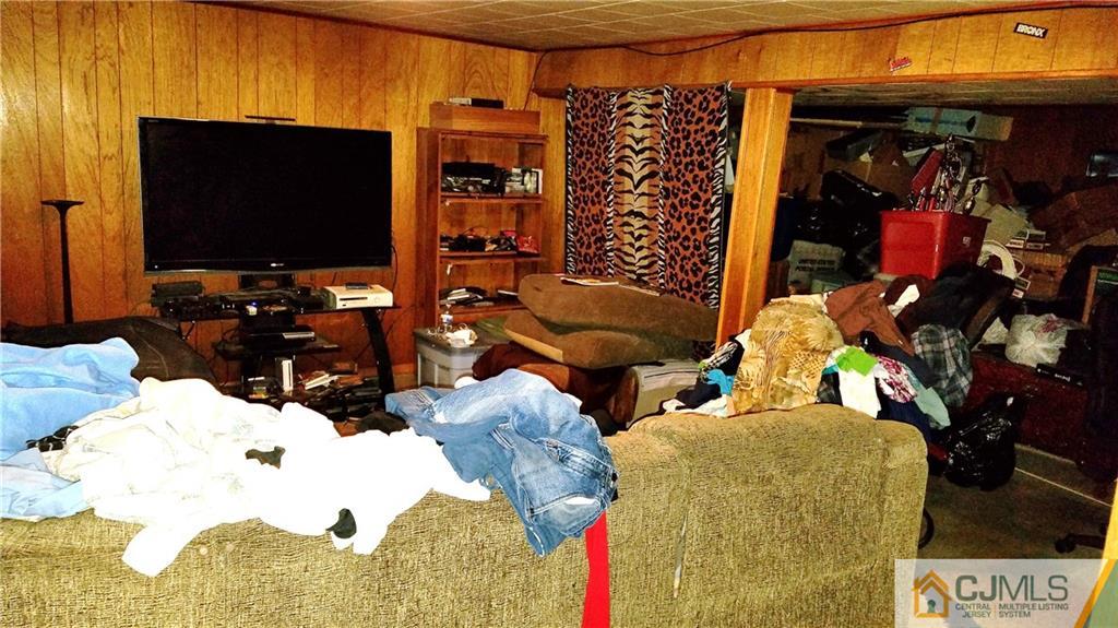 572 New Dover Road Colonia, NJ 07067 - Photo 6 of 10 a living room with furniture and a flat screen tv