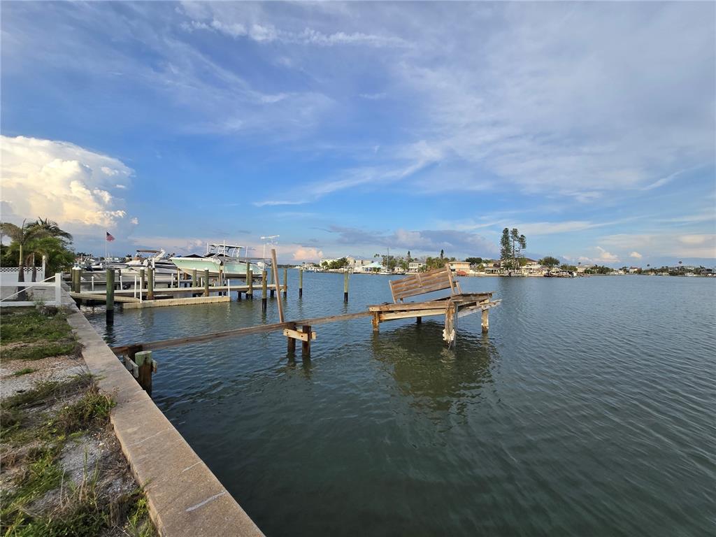 249 144th Avenue Madeira Beach, FL 33708 - Photo 3 of 5 a view of a lake with outdoor space