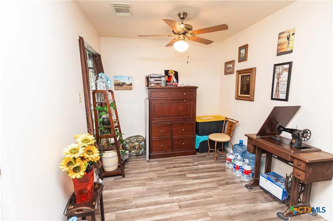 802 Bay Street Austwell, TX 77950 - Photo 7 of 27 a living room with furniture and a wooden floor