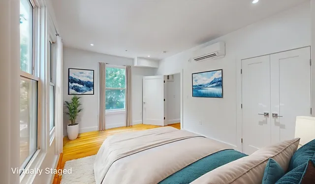 a bedroom with a bed and a couch