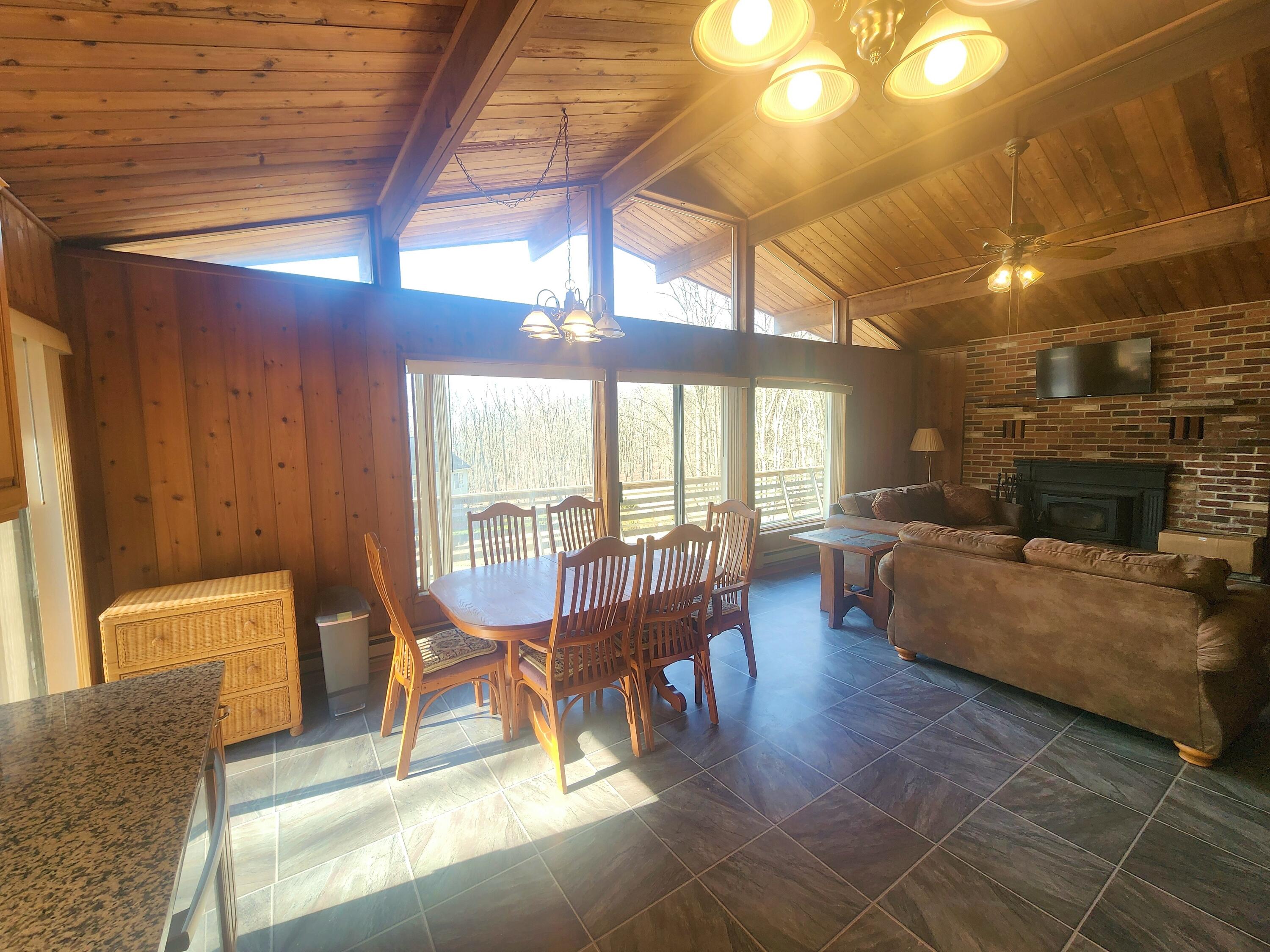 2263 Cramer Road Bushkill, PA 18324 - Photo 17 of 70 a living room with furniture and a large window
