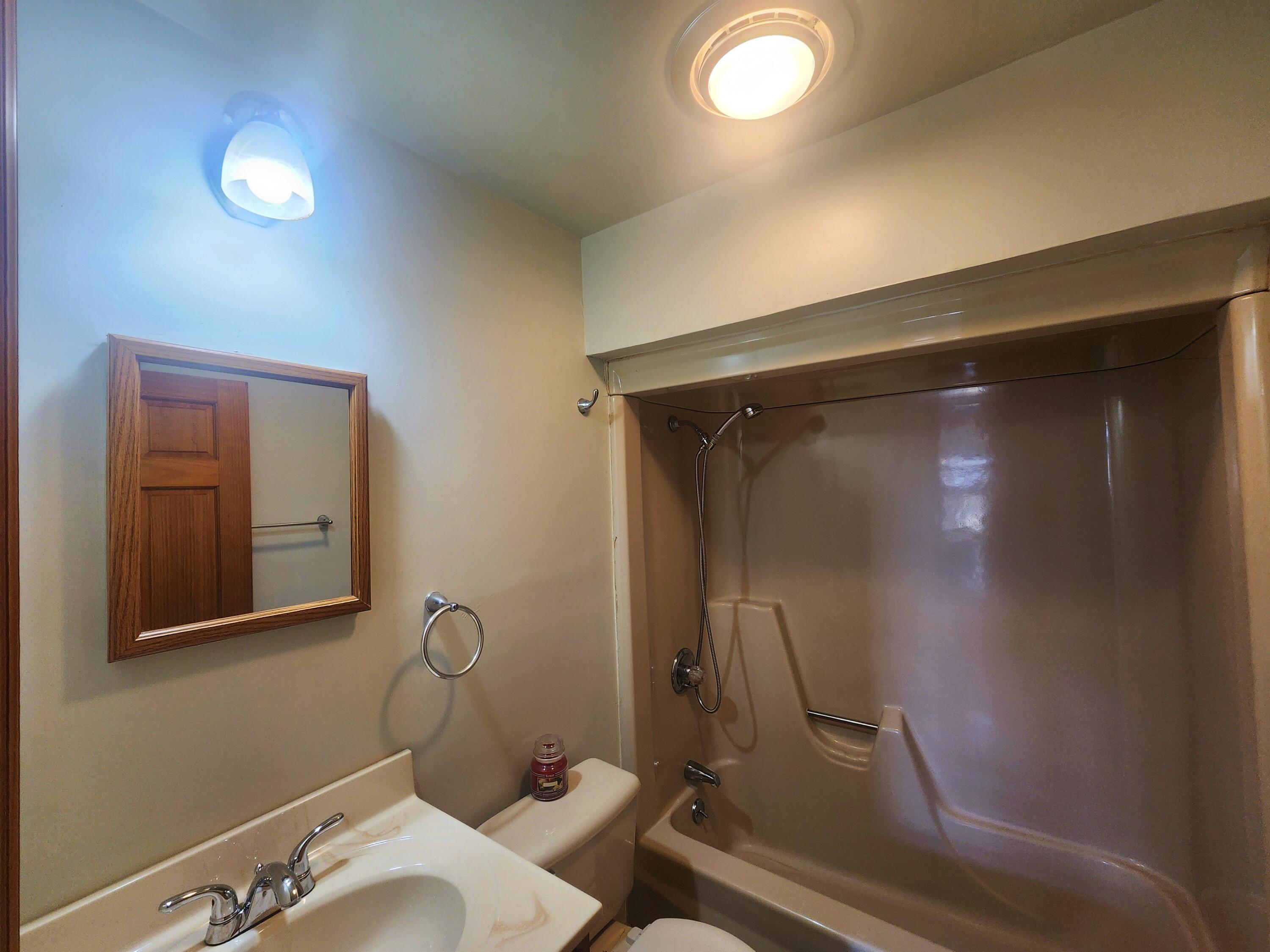 2263 Cramer Road Bushkill, PA 18324 - Photo 42 of 70 a bathroom with a sink mirror vanity and toilet