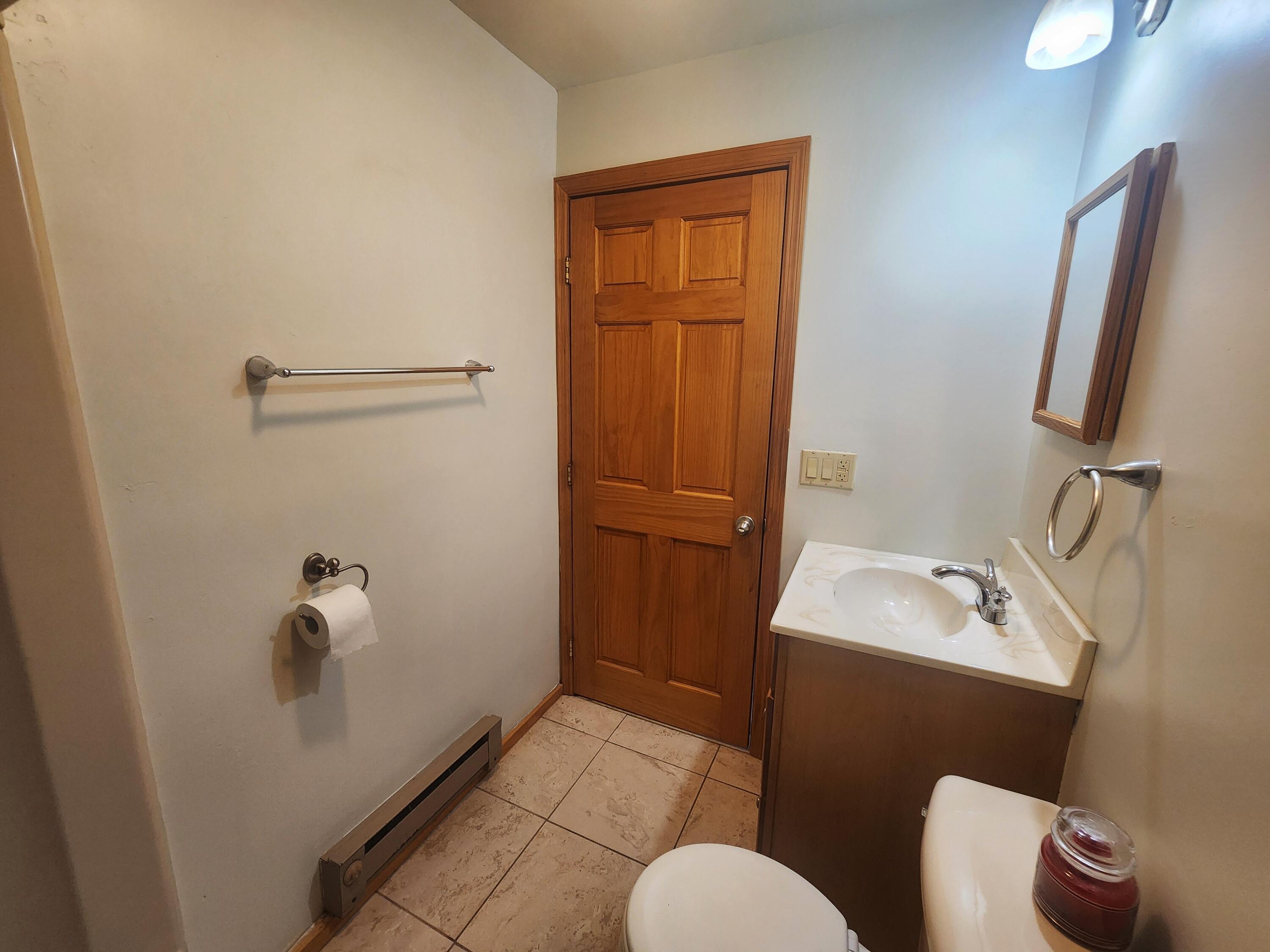 2263 Cramer Road Bushkill, PA 18324 - Photo 44 of 70 a bathroom with a sink a toilet and shower