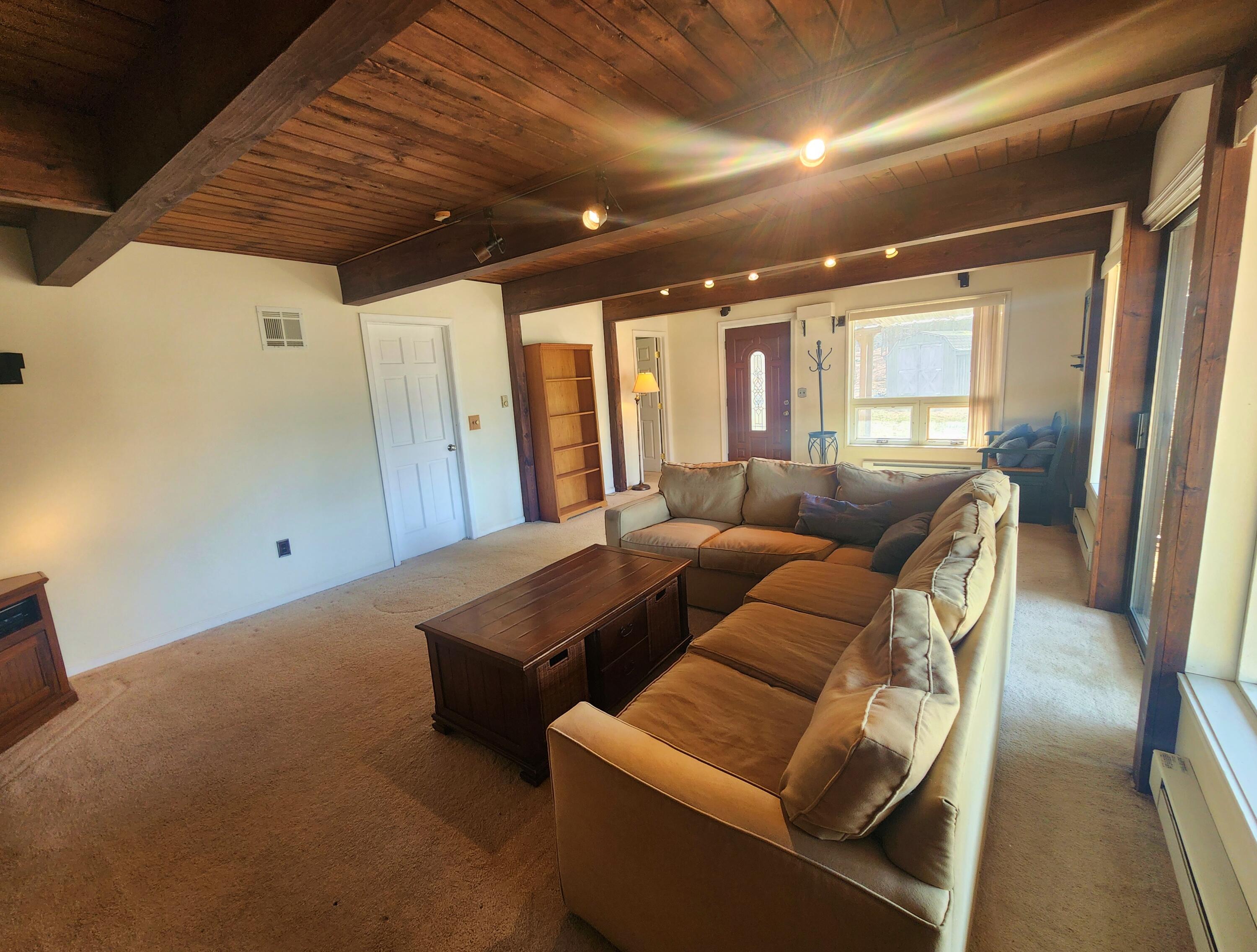 2263 Cramer Road Bushkill, PA 18324 - Photo 48 of 70 a living room with furniture and a large window