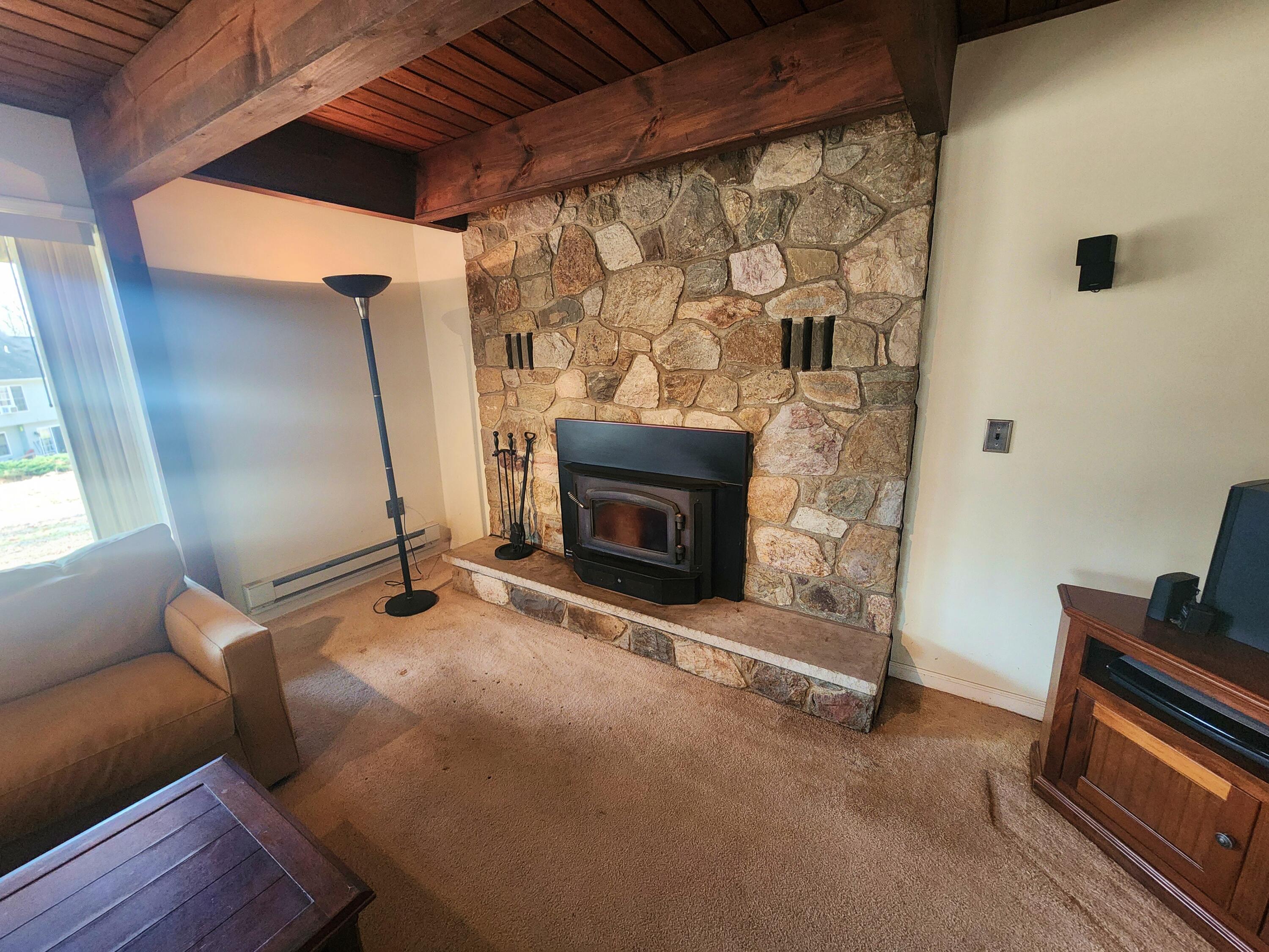 2263 Cramer Road Bushkill, PA 18324 - Photo 50 of 70 a living room with furniture and a fireplace