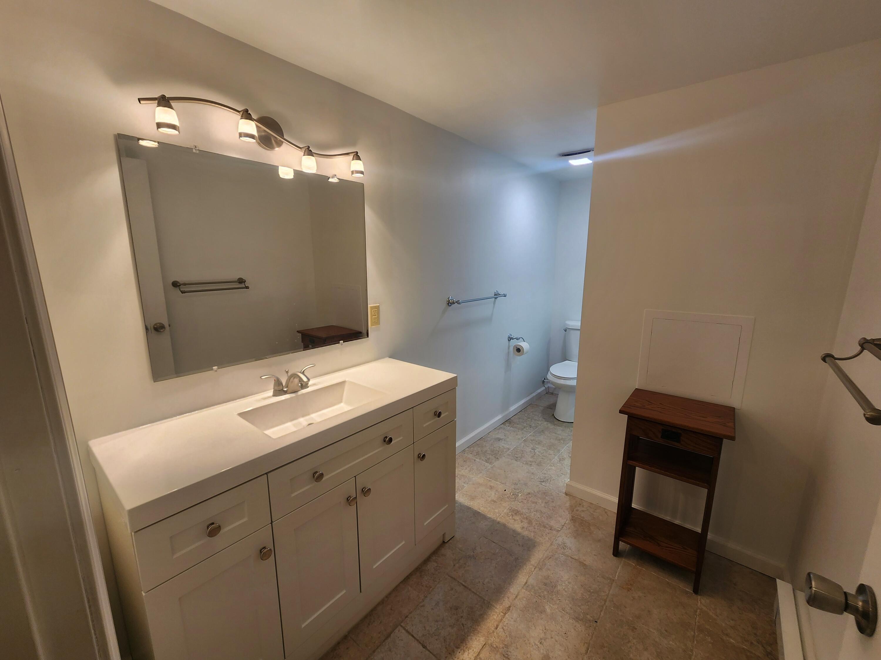 2263 Cramer Road Bushkill, PA 18324 - Photo 56 of 70 a bathroom with a double vanity sink toilet and mirror