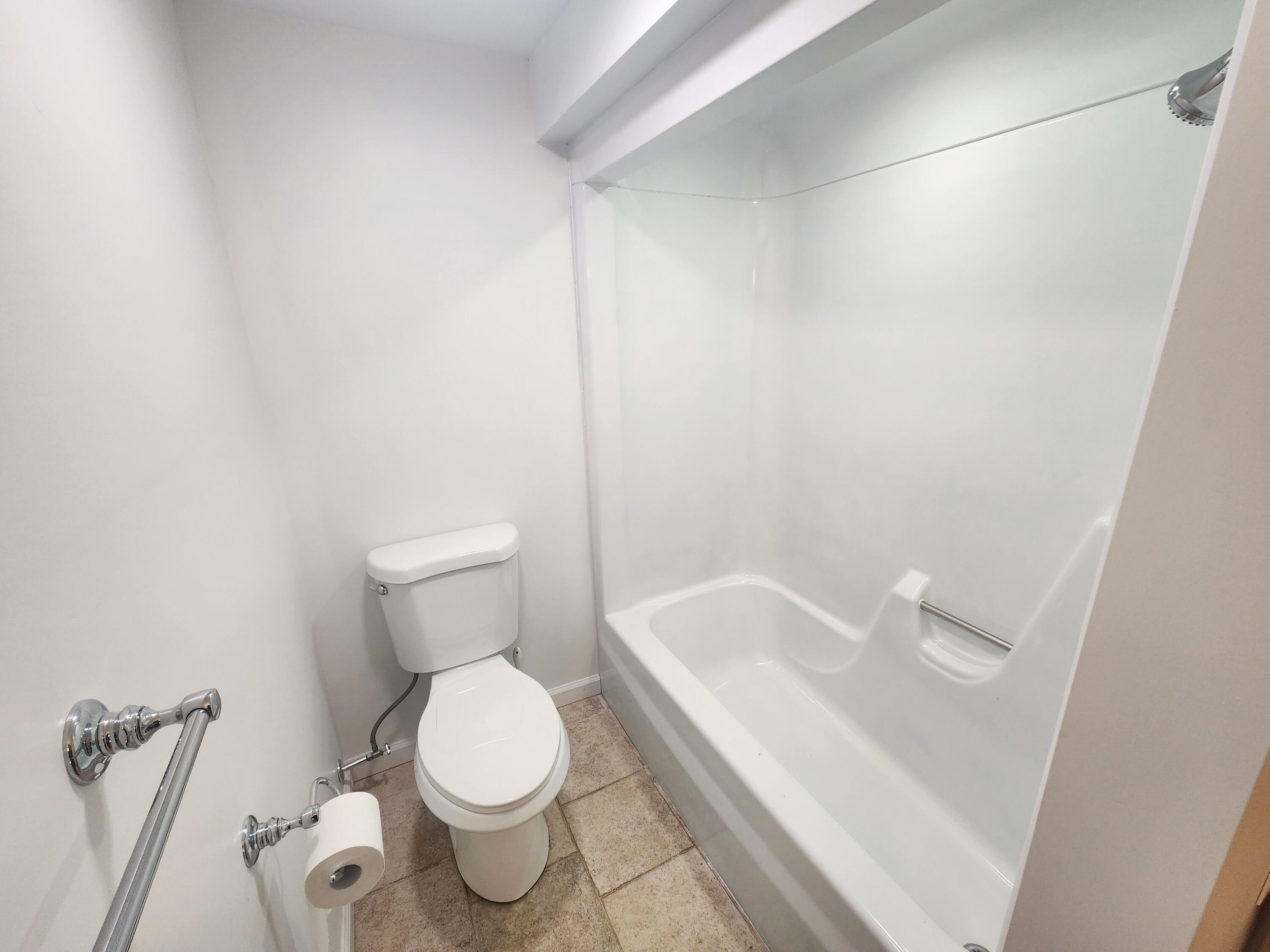 2263 Cramer Road Bushkill, PA 18324 - Photo 58 of 70 a white toilet sitting next to a white sink and vanity