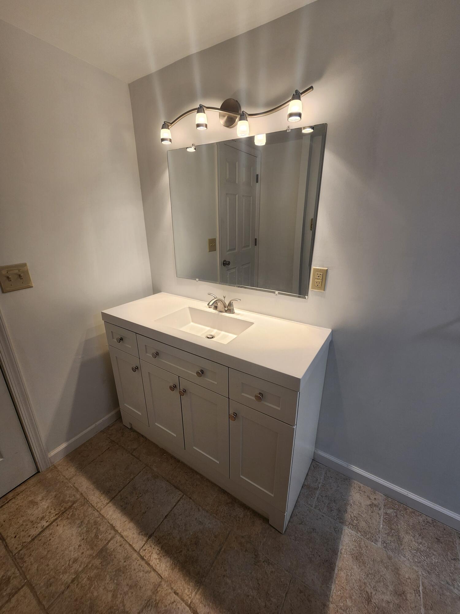 2263 Cramer Road Bushkill, PA 18324 - Photo 61 of 70 a bathroom with a sink vanity and mirror