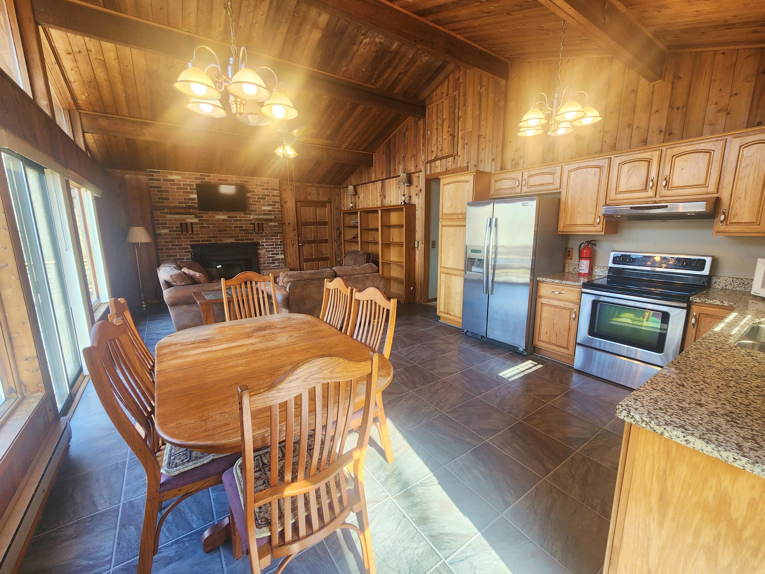 2263 Cramer Road Bushkill, PA 18324 - Photo 10 of 70 a dining room with furniture and a kitchen view