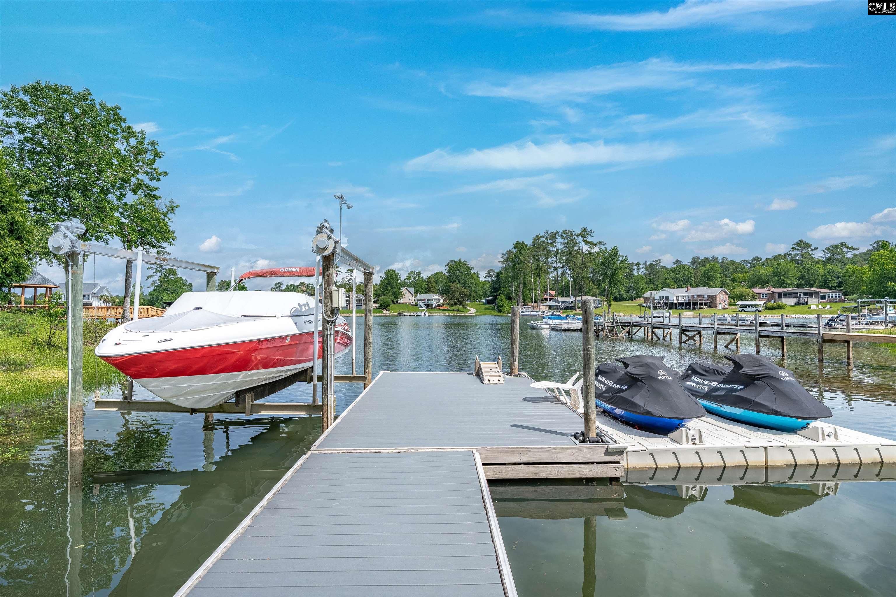 a lake view with a seating space and boat