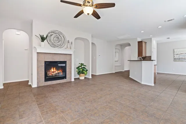 a view of an empty room with a fireplace