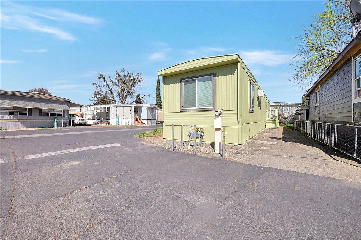 a front view of a house with basket ball court