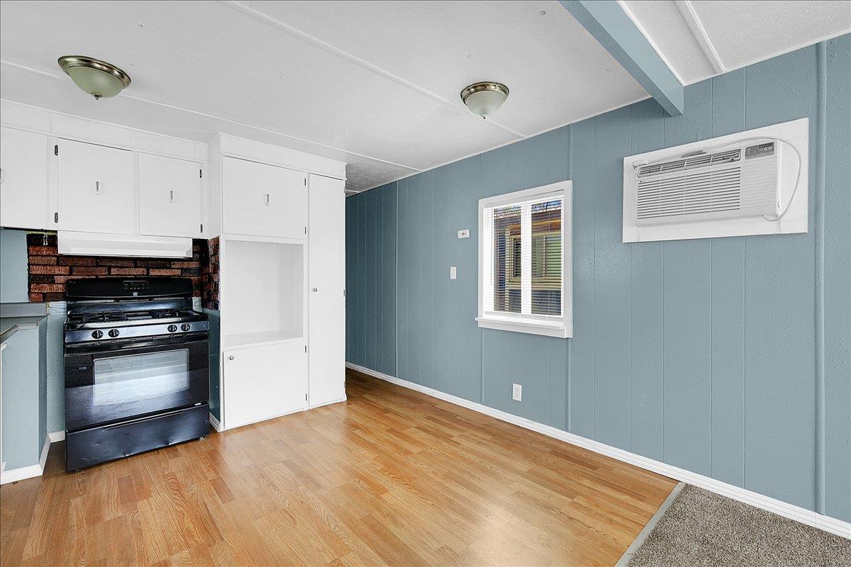 1523 North Beale Road, Unit 47 Marysville, CA 95901 - Photo 9 of 17 a kitchen with granite countertop white cabinets and stainless steel appliances