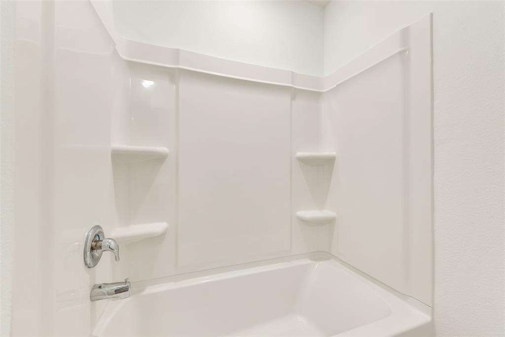 110 Wren Way Balch Springs, TX 75181 - Photo 2 of 21 a bathroom with a bathtub and shower