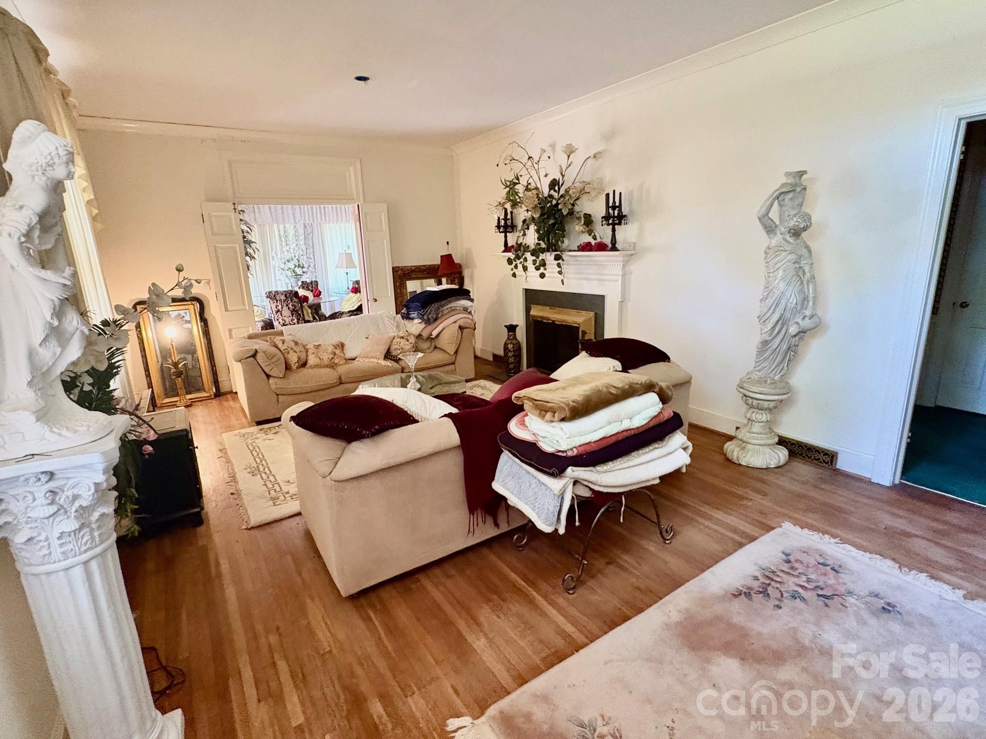 1612 South New Hope Road Gastonia, NC 28054 - Photo 16 of 38 a living room with furniture and a flat screen tv