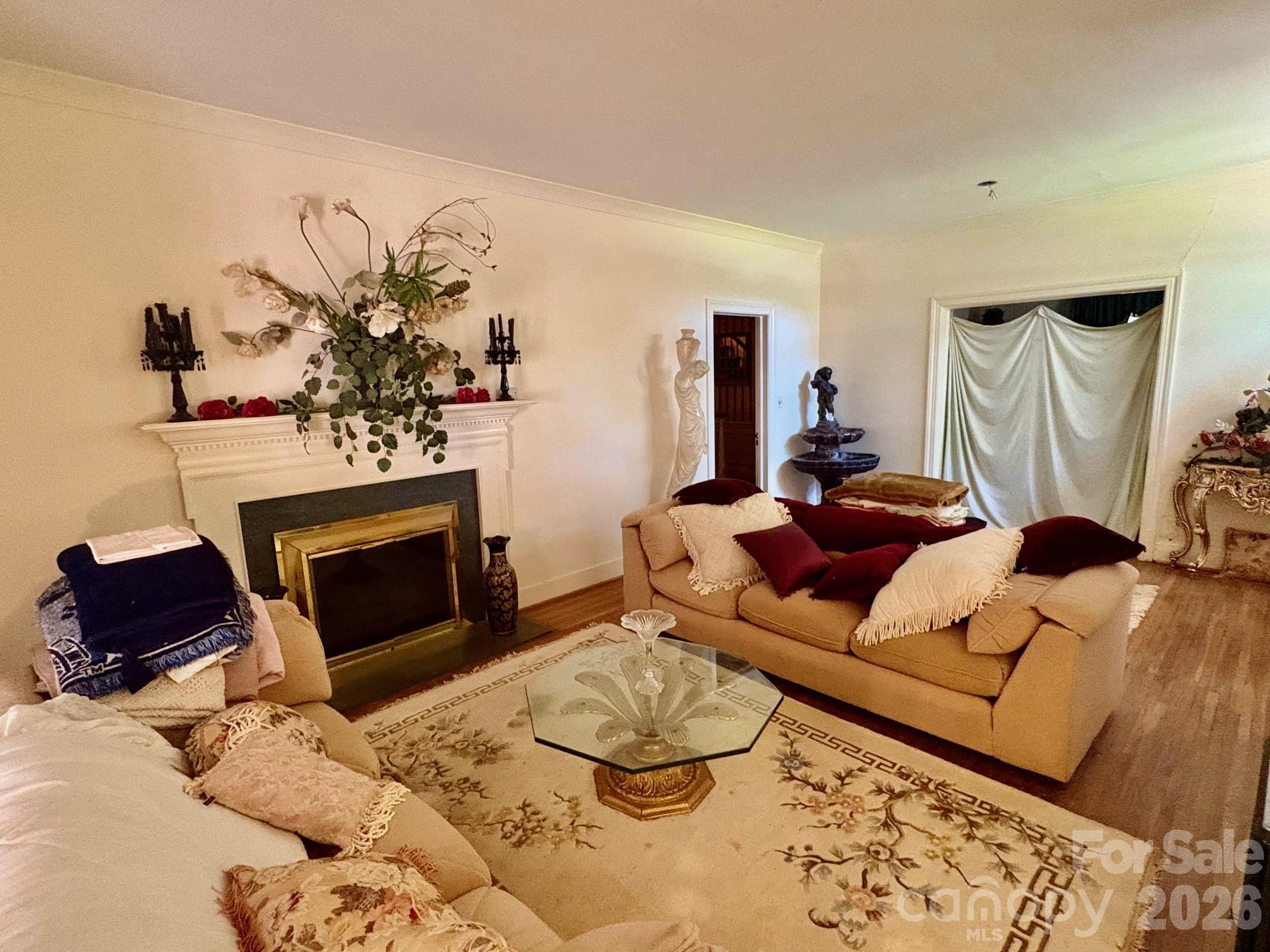 1612 South New Hope Road Gastonia, NC 28054 - Photo 17 of 38 a living room with furniture and a fireplace