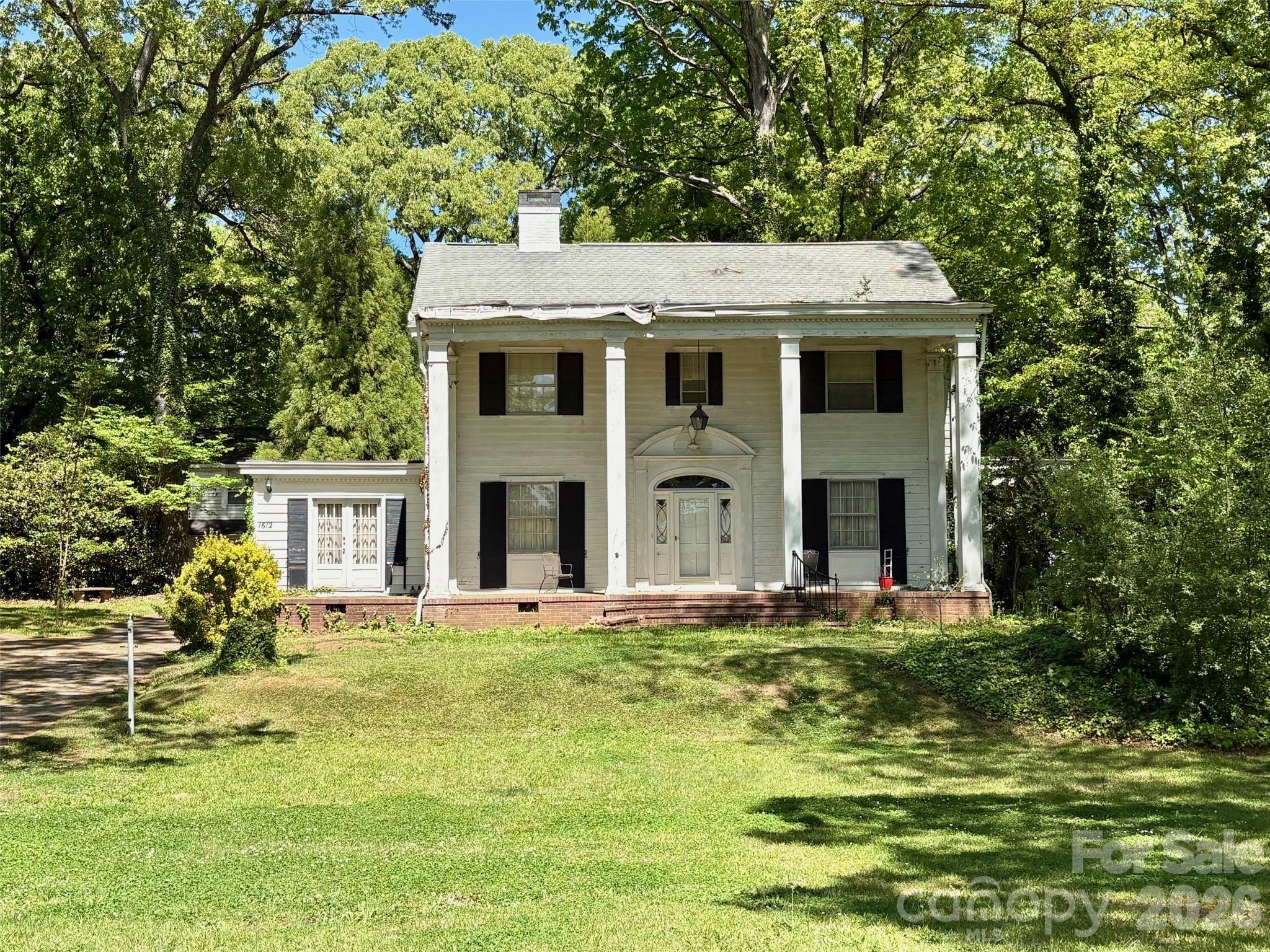 1612 South New Hope Road Gastonia, NC 28054 - Photo 2 of 38 a view of a house with a yard