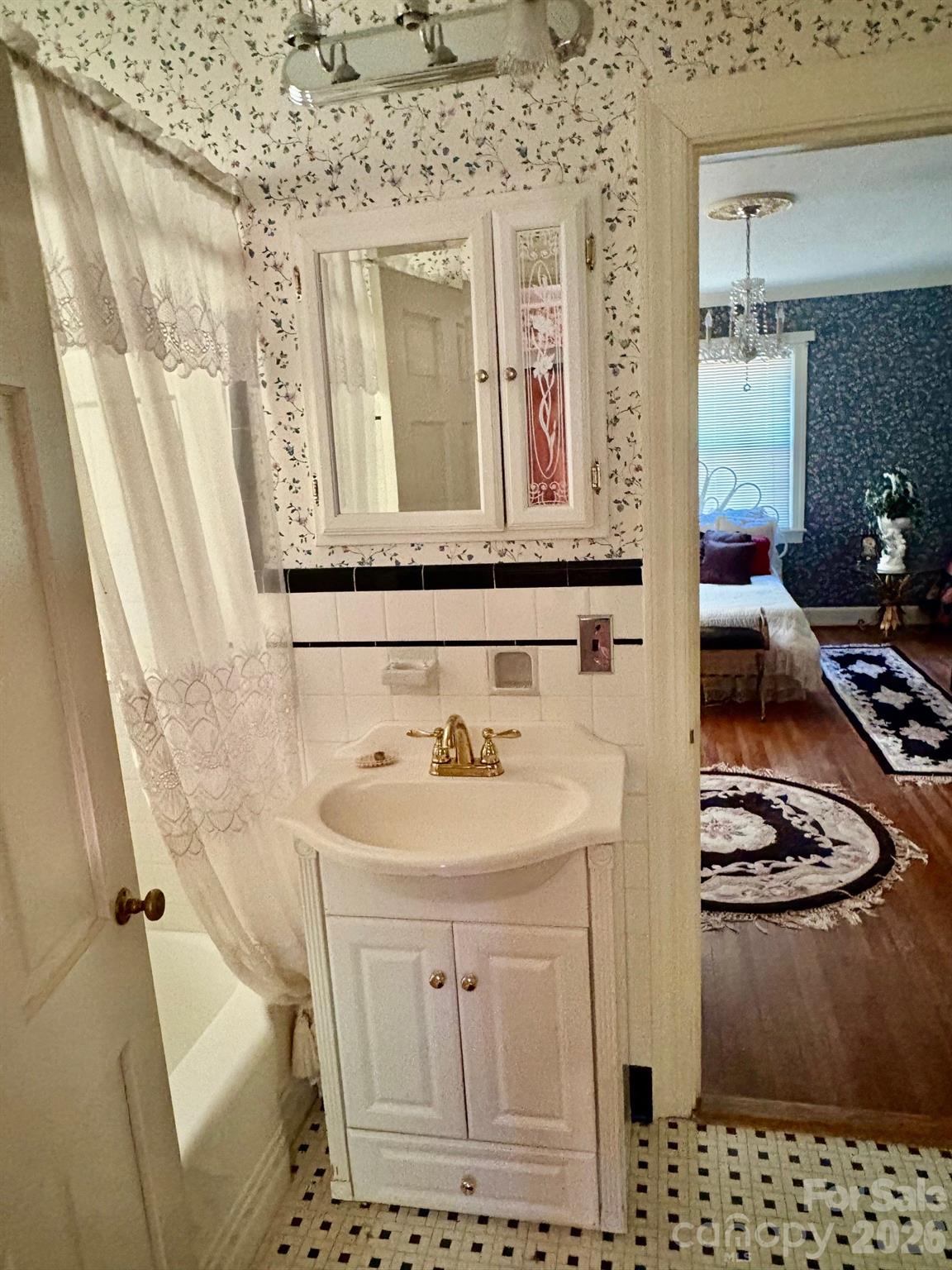 1612 South New Hope Road Gastonia, NC 28054 - Photo 24 of 38 a bathroom with a sink a toilet and shower