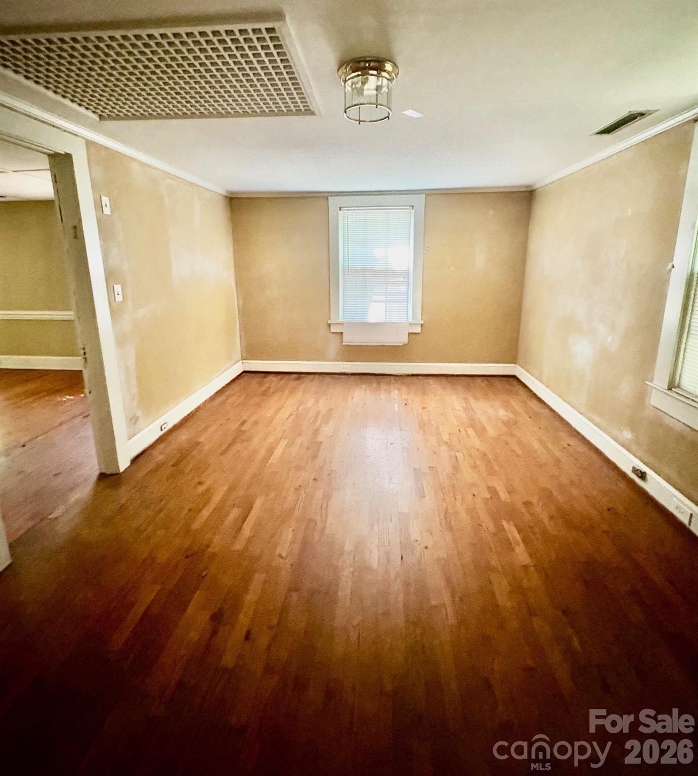 1612 South New Hope Road Gastonia, NC 28054 - Photo 33 of 38 an empty room with wooden floor