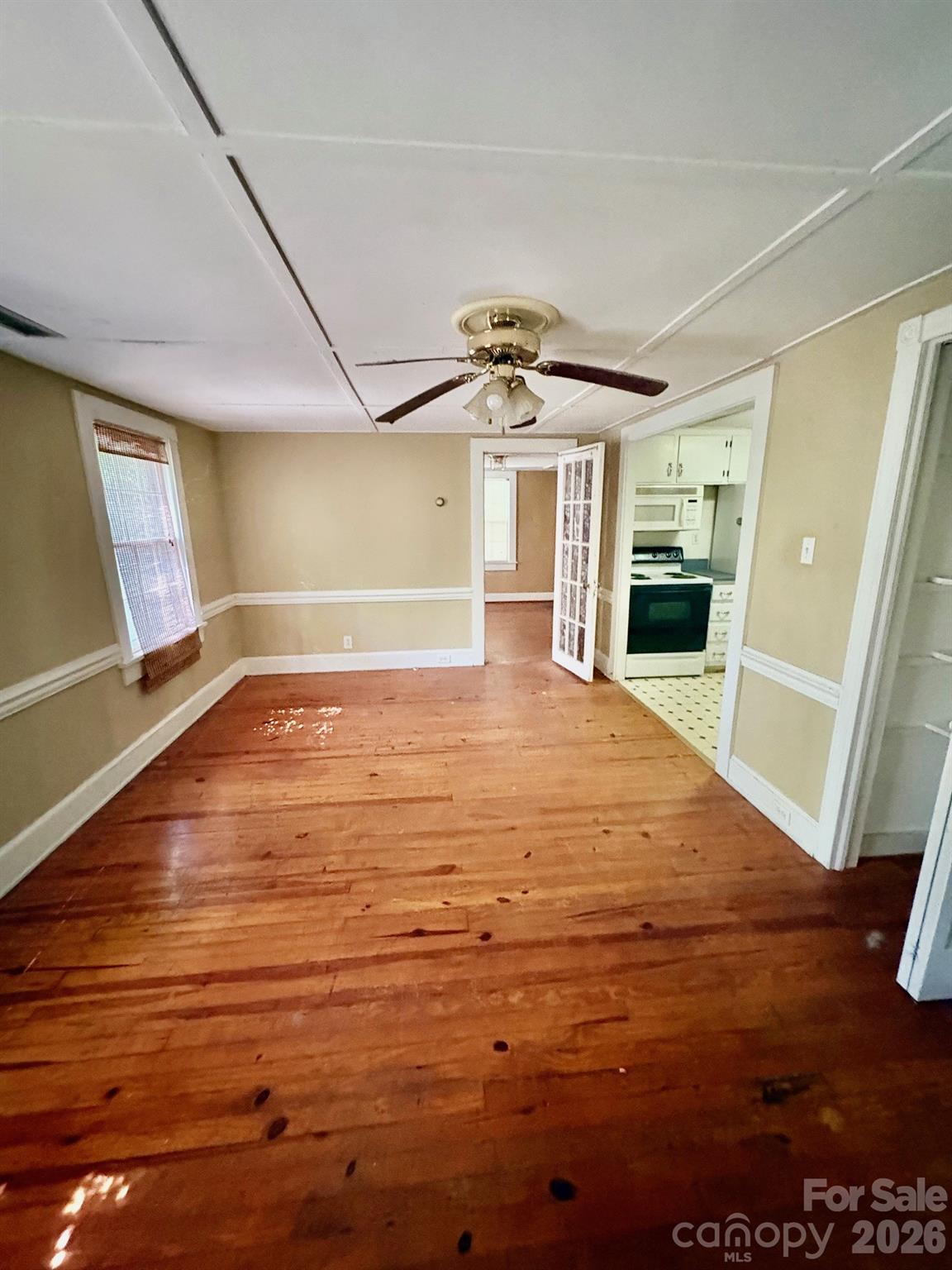 1612 South New Hope Road Gastonia, NC 28054 - Photo 36 of 38 a view of an empty room with window and wooden floor