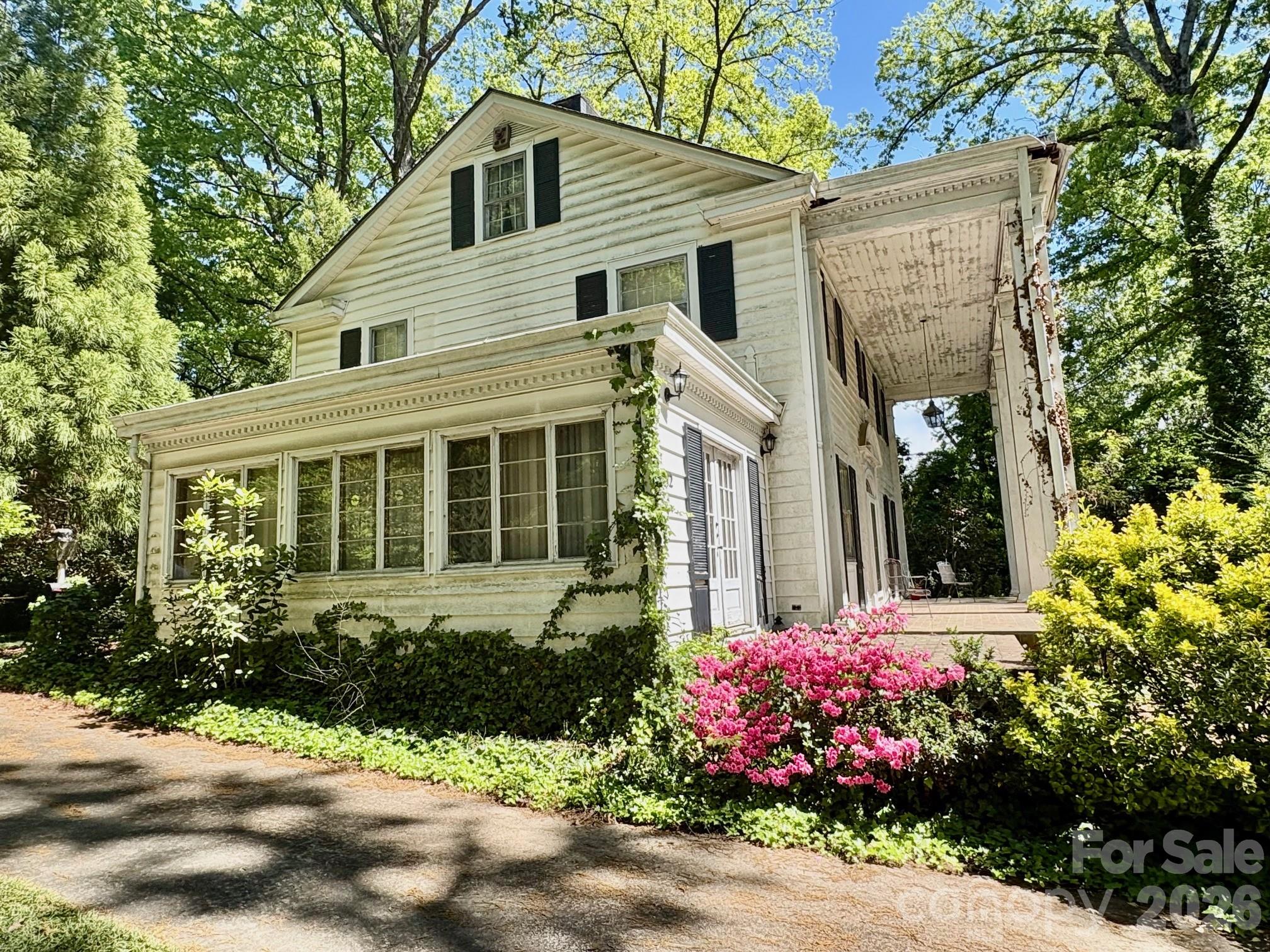 1612 South New Hope Road Gastonia, NC 28054 - Photo 6 of 38 a front view of a house with a yard and outdoor seating