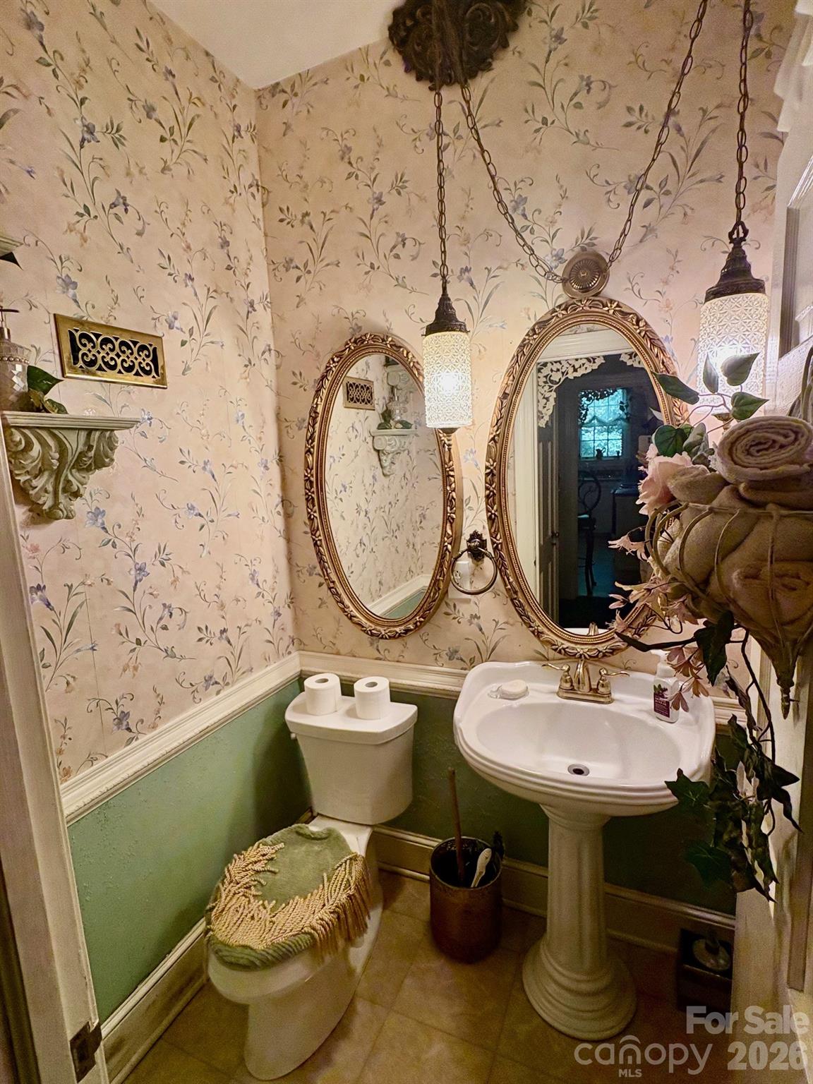 1612 South New Hope Road Gastonia, NC 28054 - Photo 10 of 38 a bathroom with a toilet sink and mirror