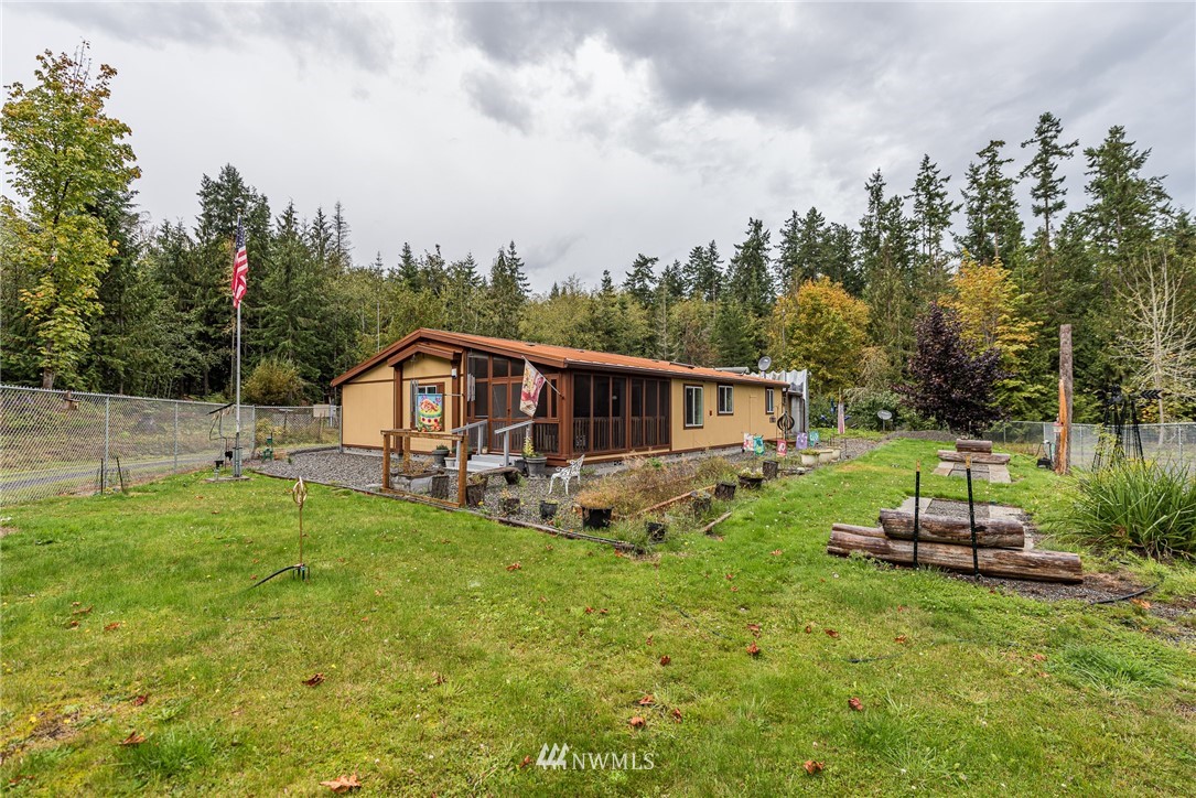 13 North Eldridge Road Sequim, WA 98382 - Photo 1 of 23 a view of a house with backyard and trees
