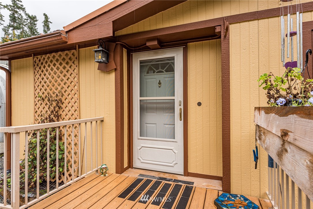 13 North Eldridge Road Sequim, WA 98382 - Photo 2 of 23 a view of a house with a wooden door