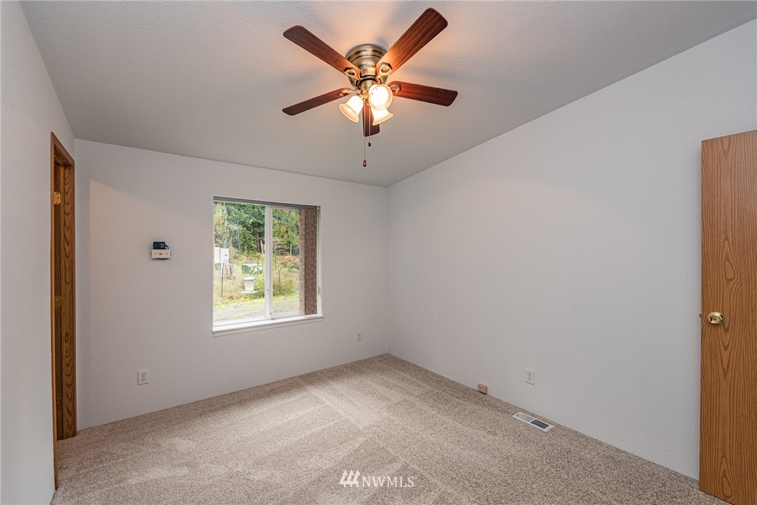 13 North Eldridge Road Sequim, WA 98382 - Photo 14 of 23 a view of an empty room with window and a ceiling fan