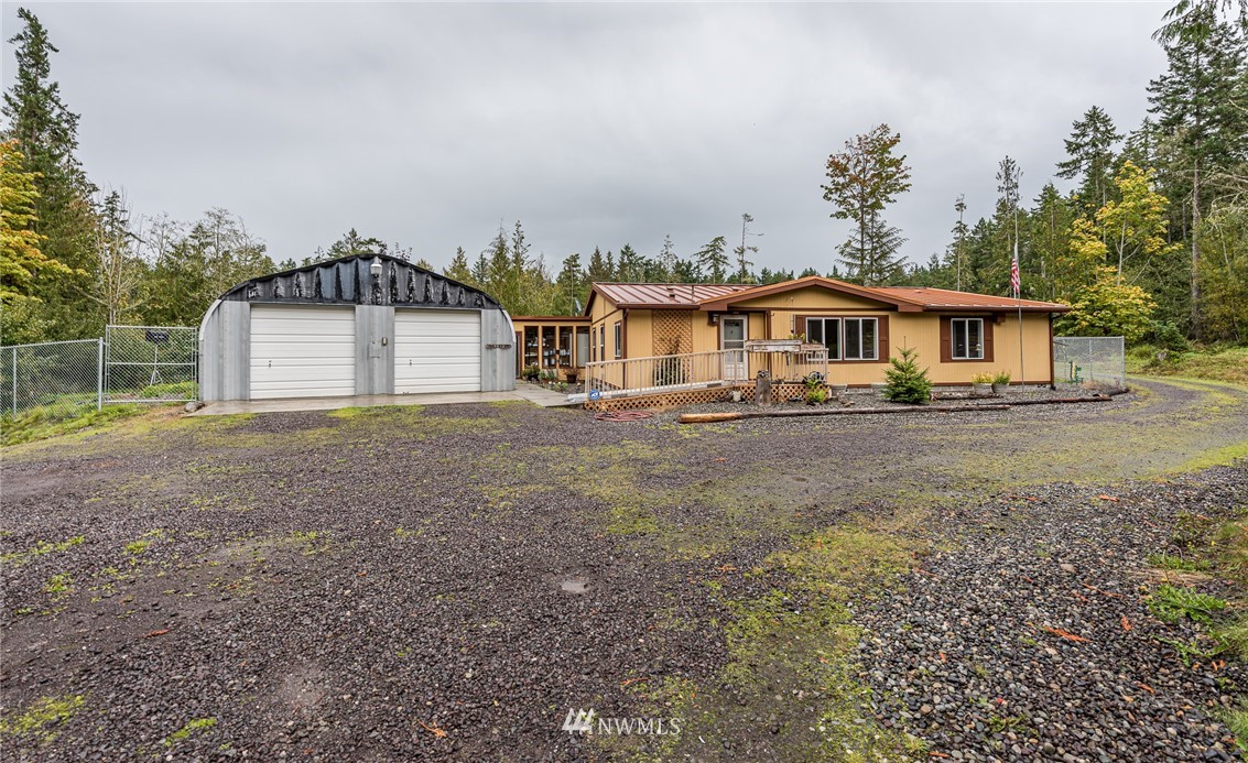 13 North Eldridge Road Sequim, WA 98382 - Photo 23 of 23 a front view of a house with a yard and trees