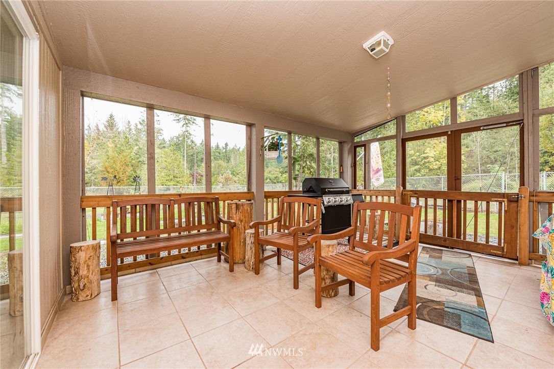 13 North Eldridge Road Sequim, WA 98382 - Photo 6 of 23 a living room with furniture and floor to ceiling windows