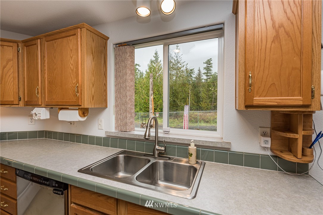 13 North Eldridge Road Sequim, WA 98382 - Photo 9 of 23 a kitchen with a sink and a window