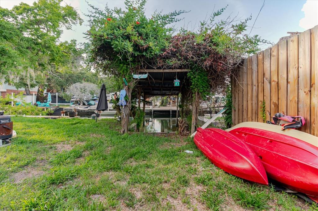 5323 Circle Drive Weeki Wachee, FL 34607 - Photo 69 of 77 a view of a backyard with sitting area