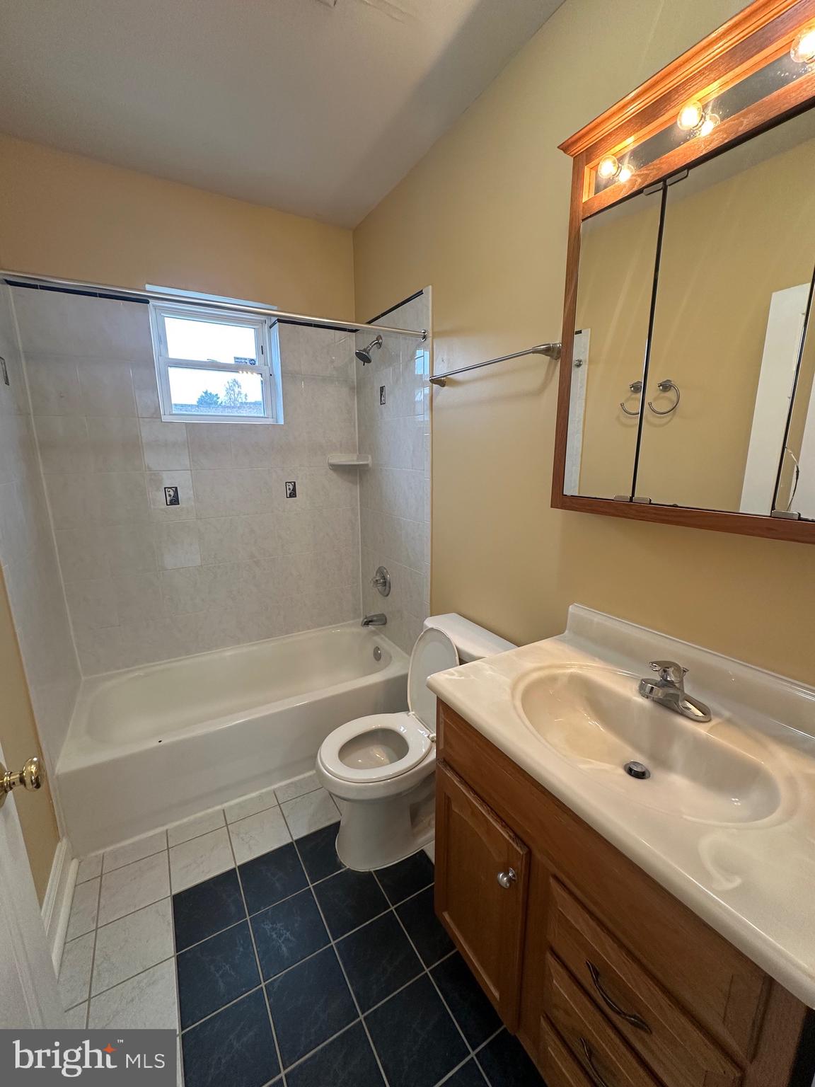 422 West Franklin Street, Unit 1B Baltimore, MD 21201 - Photo 14 of 17 a bathroom with a sink a toilet and shower