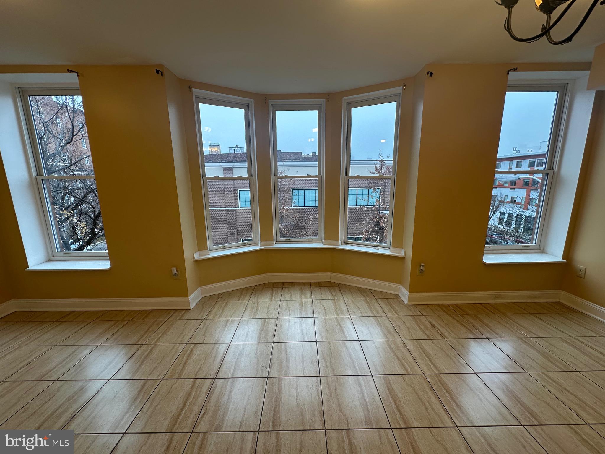422 West Franklin Street, Unit 1B Baltimore, MD 21201 - Photo 3 of 17 a view of an empty room with a window