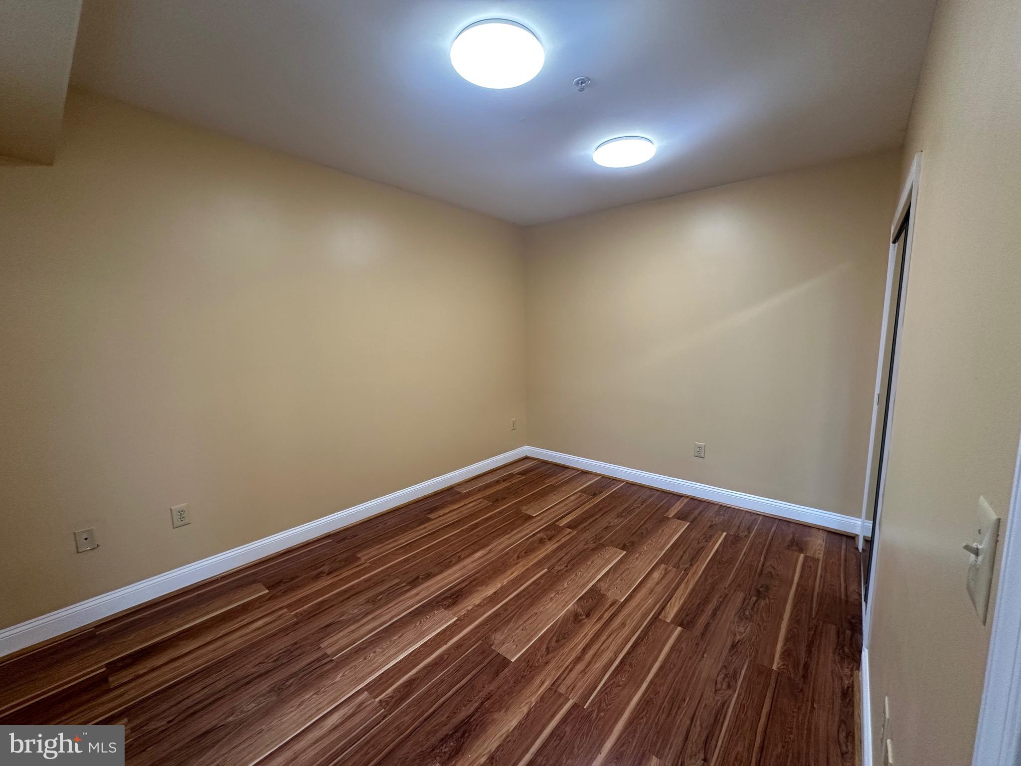 422 West Franklin Street, Unit 1B Baltimore, MD 21201 - Photo 8 of 17 a view of room with wooden floor