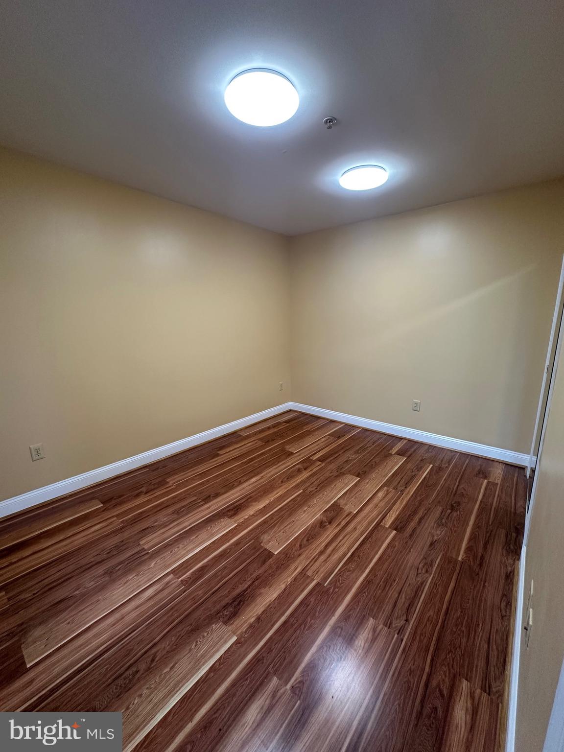 422 West Franklin Street, Unit 1B Baltimore, MD 21201 - Photo 9 of 17 a view of room with wooden floor