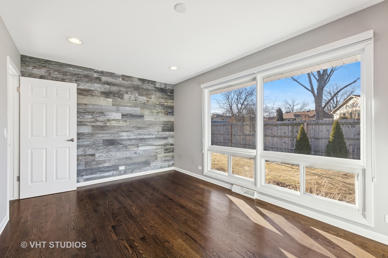 275 East Harrison Road Lombard, IL 60148 - Photo 5 of 31 a view of an empty room with wooden floor and a window