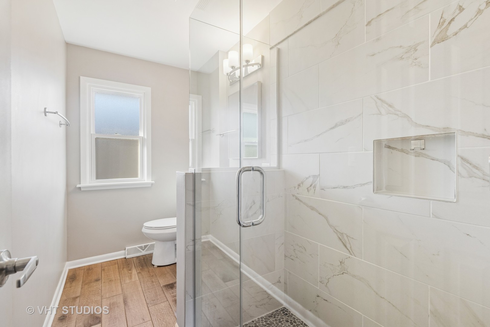 275 East Harrison Road Lombard, IL 60148 - Photo 10 of 31 a bathroom with a toilet and a shower