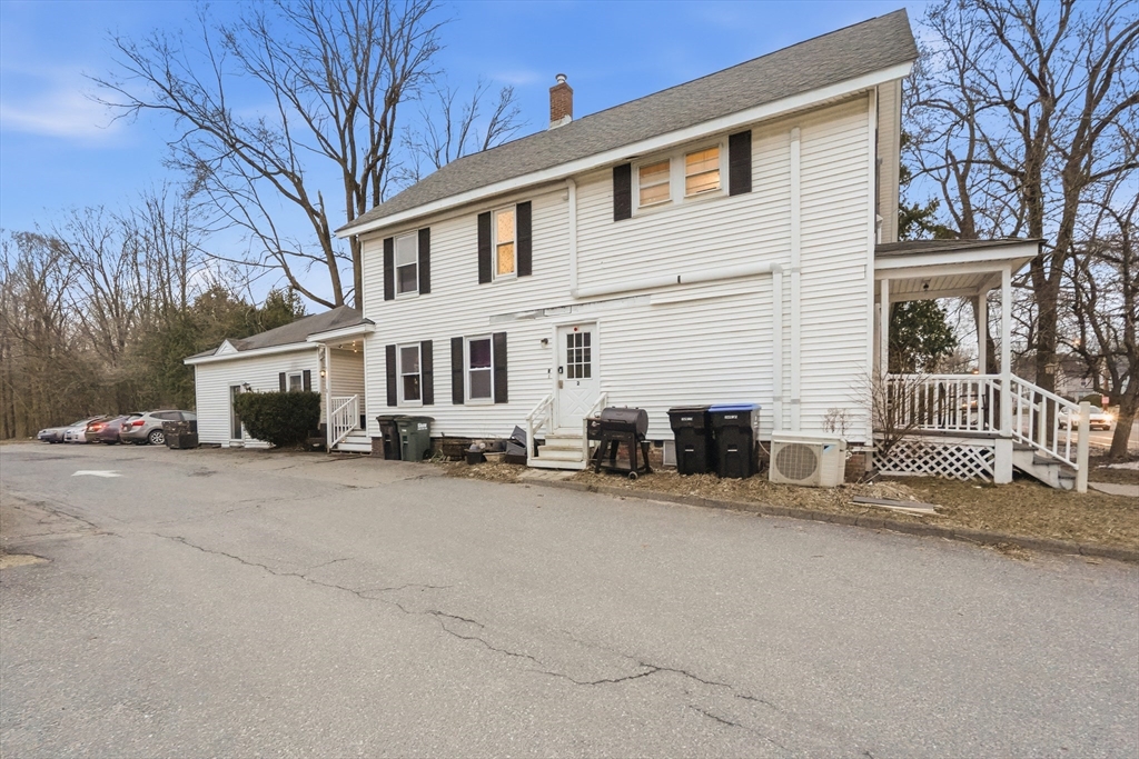 72 Main Street Pepperell, MA 01463 - Photo 2 of 26 a view of a house with a patio