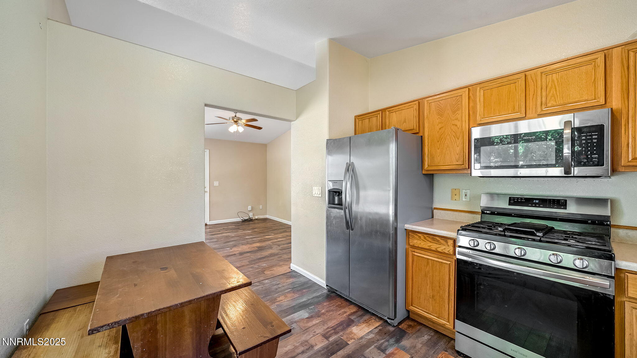 17776 Fortune Court Reno, NV 89508 - Photo 12 of 28 a kitchen with wooden floor and steel stainless steel appliances