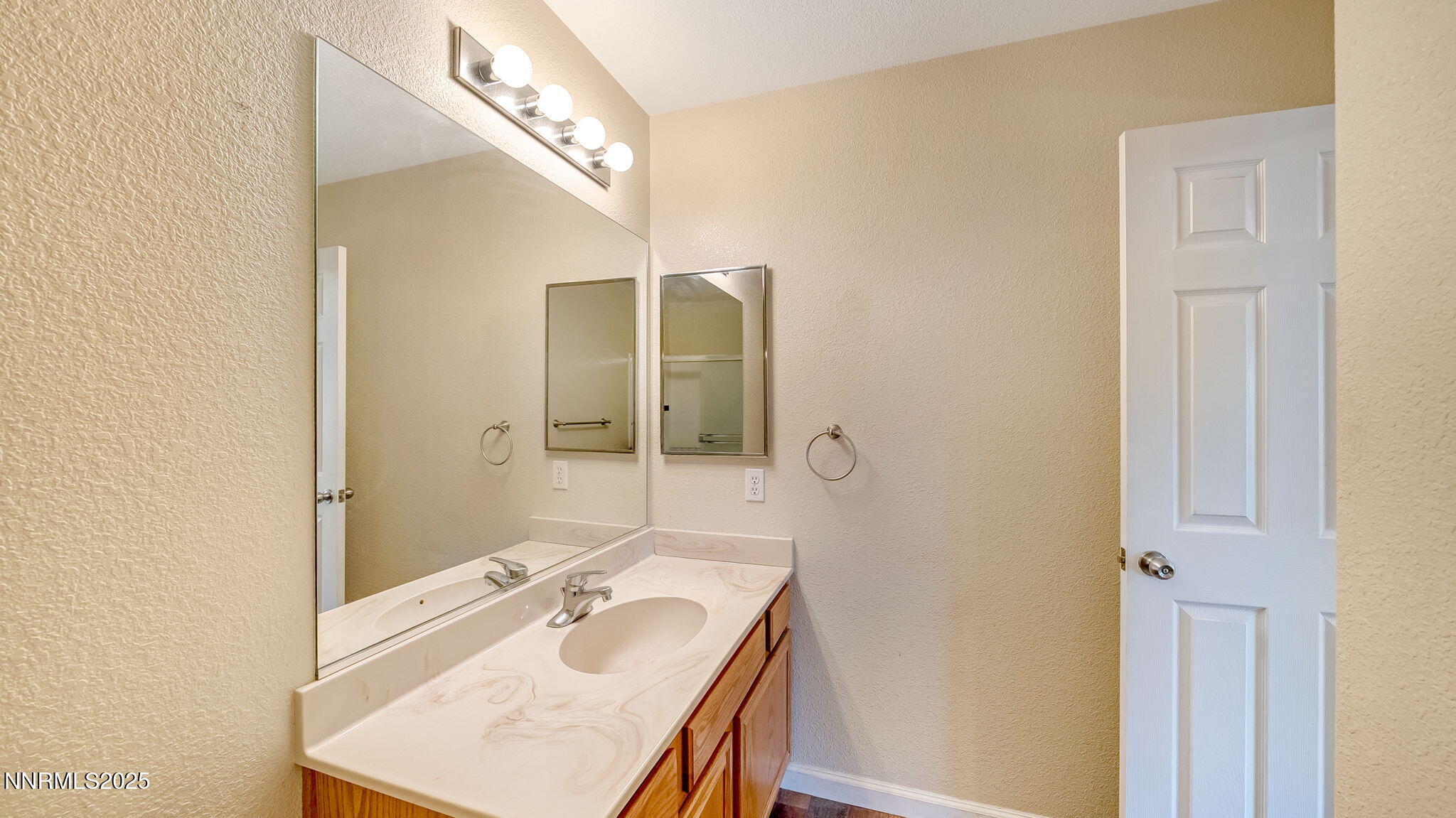 17776 Fortune Court Reno, NV 89508 - Photo 16 of 28 a bathroom with a sink and a mirror