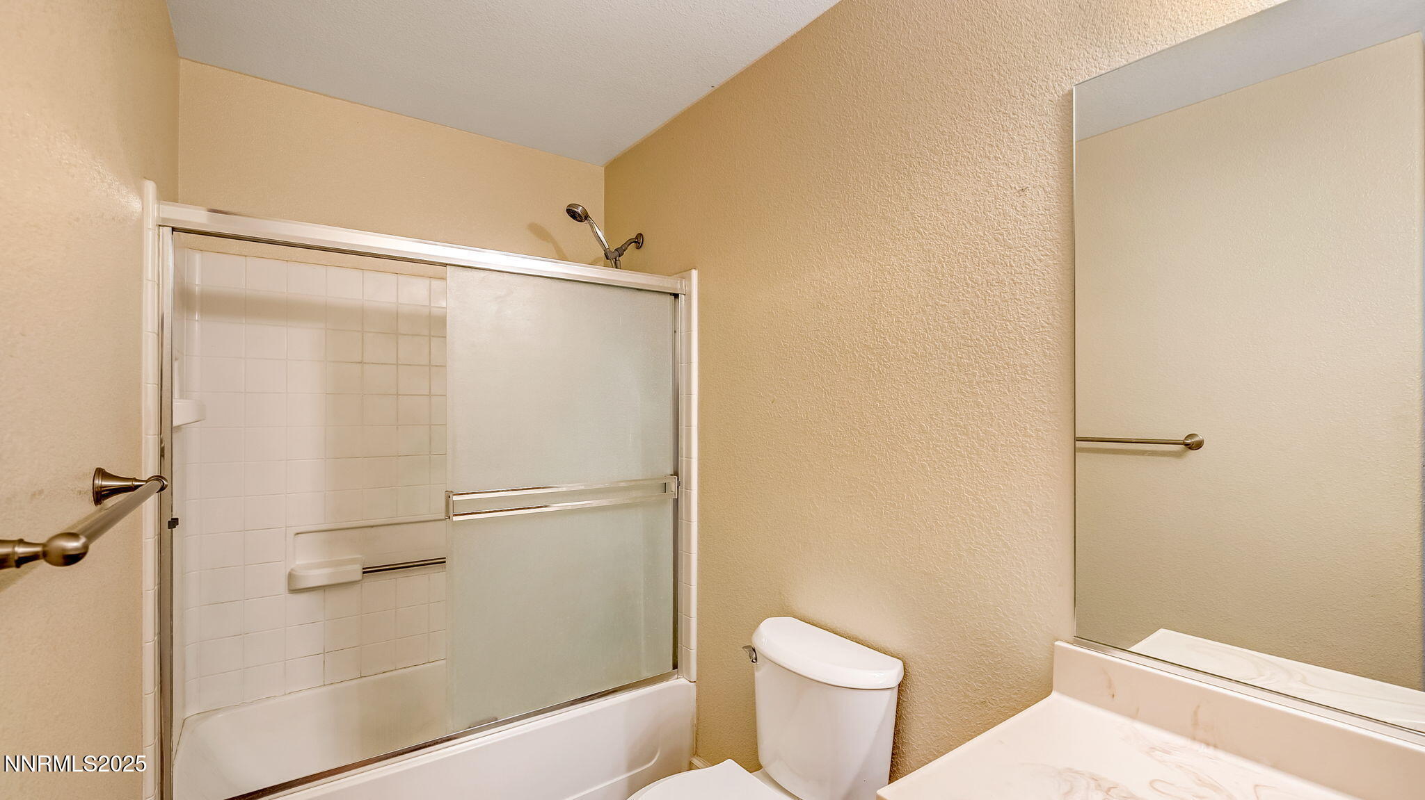17776 Fortune Court Reno, NV 89508 - Photo 17 of 28 a bathroom with a shower and a toilet