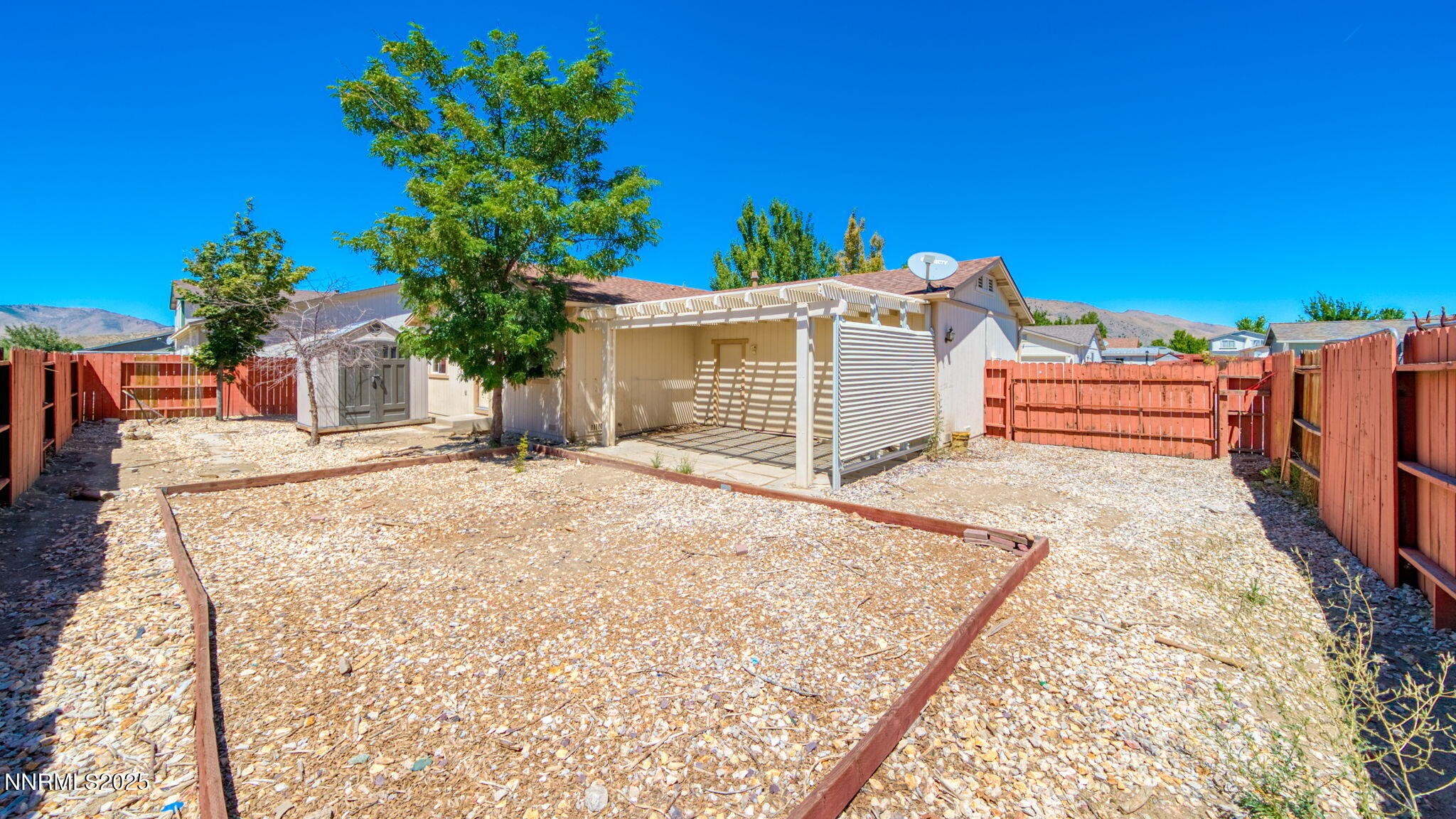17776 Fortune Court Reno, NV 89508 - Photo 26 of 28 a view of a backyard with a garden