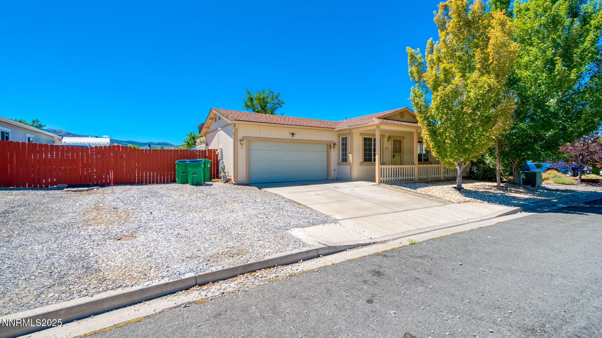 17776 Fortune Court Reno, NV 89508 - Photo 3 of 28 a front view of a house with a yard and garage