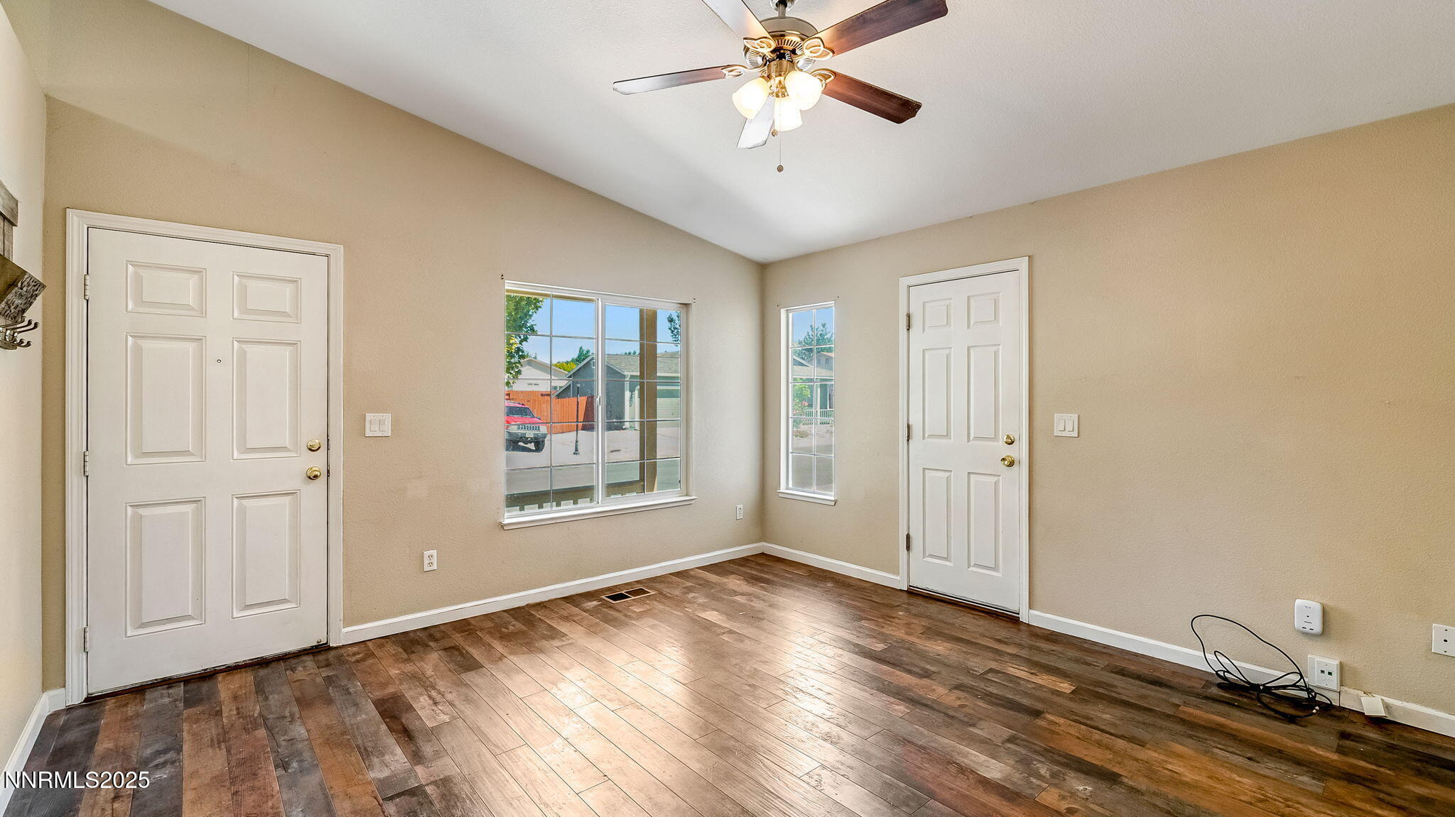 17776 Fortune Court Reno, NV 89508 - Photo 6 of 28 wooden floor in an empty room with a window