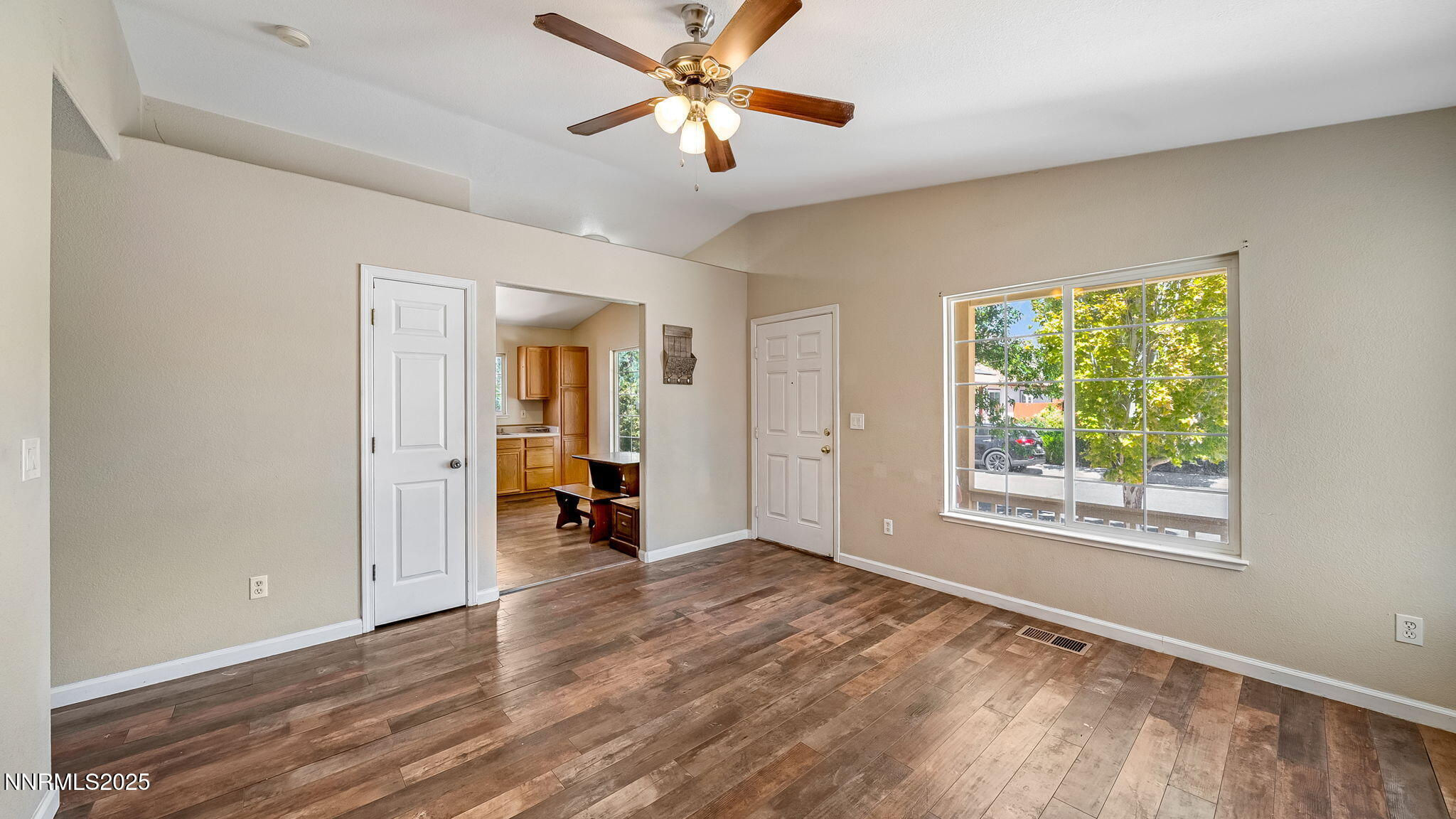 17776 Fortune Court Reno, NV 89508 - Photo 7 of 28 a view of empty room with wooden floor and fan