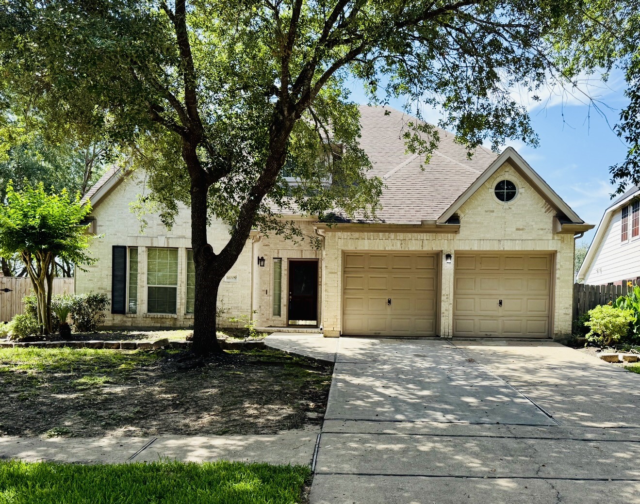 14009 Hollow Canyon Lane Rosharon, TX 77583 - Photo 1 of 20 a front view of a house with a yard and potted plants