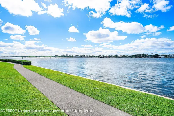 a view of a lake with houses in the back